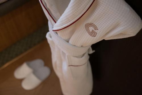 a baseball player wearing a white uniform with hearts on his legs at The Guardsman - Preferred Hotels and Resorts in London