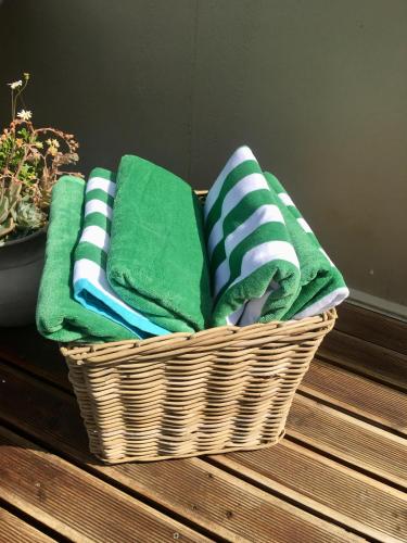 a basket filled with towels sitting on a table at Sage in Montagu
