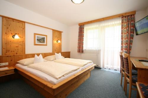Ein Bett oder Betten in einem Zimmer der Unterkunft Hotel Cafe' Hermann