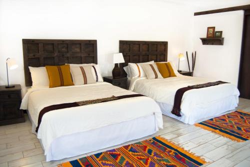 Postel nebo postele na pokoji v ubytování Villas de la Ermita