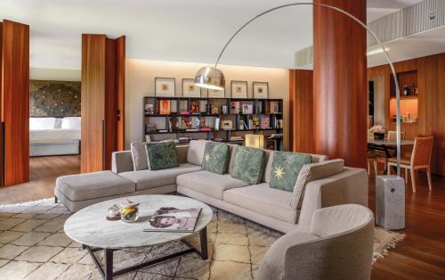 a living room with a couch and a table at Bulgari Hotel Milano in Milan