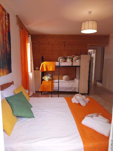a bedroom with a large bed with towels on it at Casa Lachesi in Caccamo
