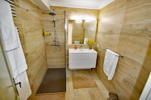 a bathroom with a sink and a shower at Luxury Pool Apartment at Villa Seburga in Saint-Paul-de-Vence