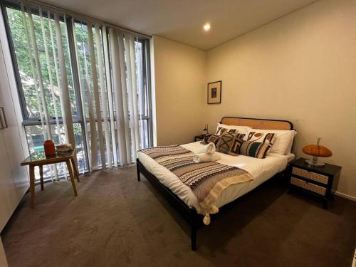 Кровать или кровати в номере Sydney CBD 2B1B Sussex Cozy Stay