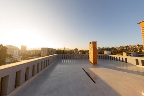 a balcony with a view of a city at Doors Boutique Hotel in Tbilisi City