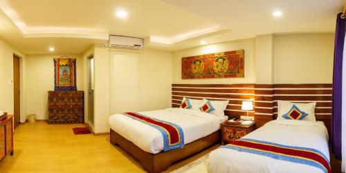 a hotel room with two beds in a room at Truly Asia Boutique Hotel in Kathmandu