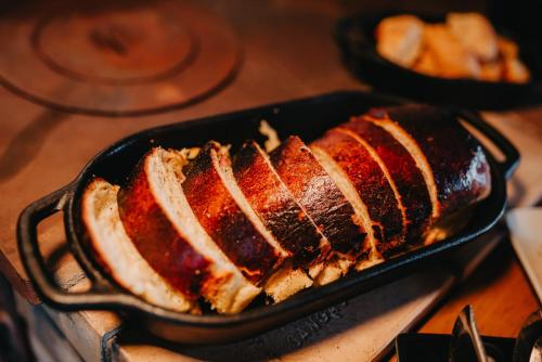 a loaf of bread in a pan on a stove at WoodStone Hotel Fazenda in Gramado