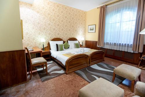 Postel nebo postele na pokoji v ubytování Nyerges Hotel Termál Superior