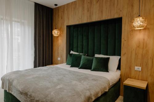 Ένα ή περισσότερα κρεβάτια σε δωμάτιο στο Hotel Muntele Mic