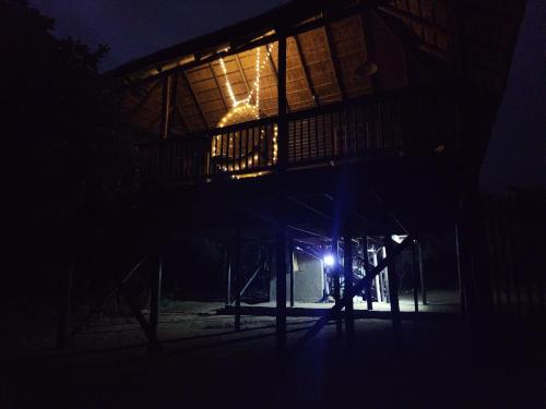 a nighttime picture of a playground at night at Amare Cabin in the bush with all your needs! in Marloth Park