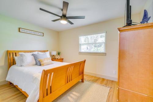a bedroom with a bed and a ceiling fan at Bikes, Kayak and Dock Lakefront Inverness Retreat in Inverness