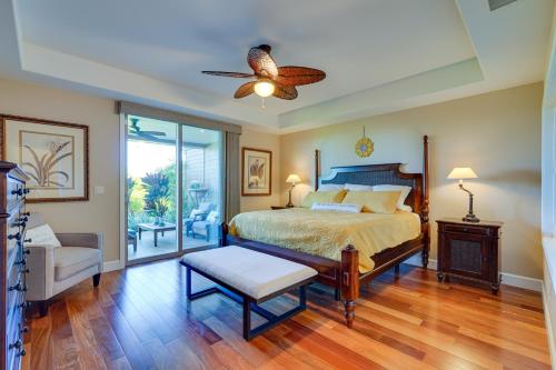 a bedroom with a bed and a ceiling fan at KaMilo at Mauna Lani Condo with Resort Pool Access! in Waikoloa