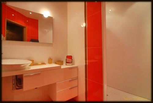 a bathroom with a white sink and a shower at High standing chalet / SPA overlooking the valley in Eyne
