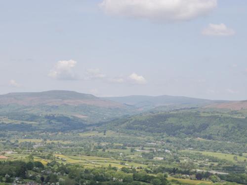 a view of a valley with hills and trees at Builth House in Abergavenny