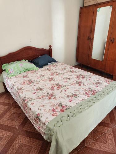 a bed in a bedroom with a dresser at Rental Furnished Studio in Port Louis