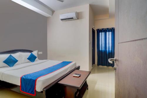Säng eller sängar i ett rum på Atlas Stays at DLF Gachibowli