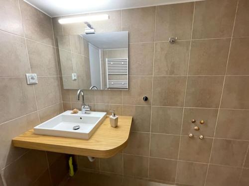 a bathroom with a sink and a mirror at DM Apartment 1 in Athens