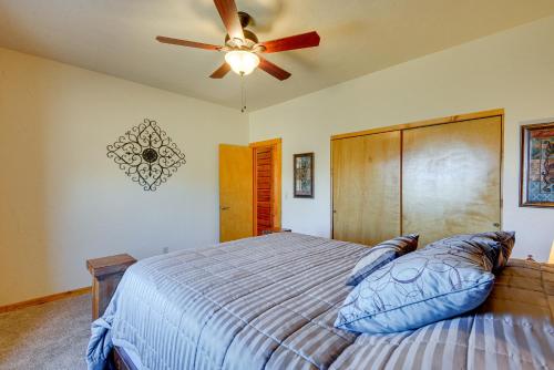 a bedroom with a bed and a ceiling fan at Large Deck and Mountain Views Prescott Getaway! in Prescott