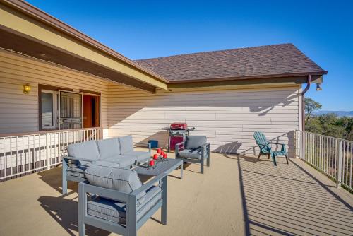 a patio with chairs and a table on a house at Large Deck and Mountain Views Prescott Getaway! in Prescott