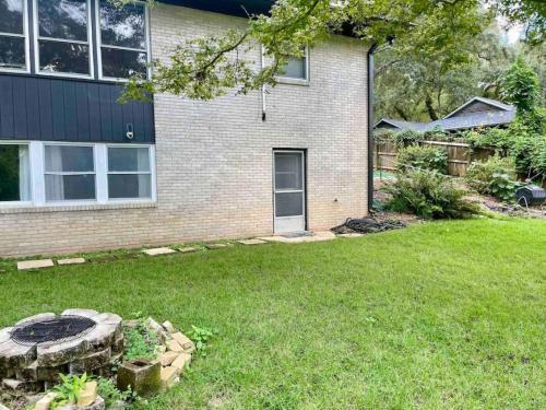 a house with a yard with a fire pit at Midtown at Marion Green 1BR 1BA, 2 miles FAMU FSU, 2blks TMH in Tallahassee