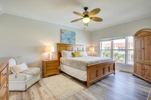 a bedroom with a bed and a ceiling fan at St Augustine Oasis Community Pool and Private Patio in Saint Augustine