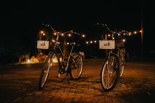 two bikes parked next to each other in the dark at WoodStone Hotel Fazenda in Gramado