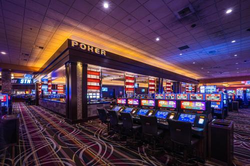 a casino with many slot machines in a room at Santa Fe Station Hotel & Casino in Las Vegas