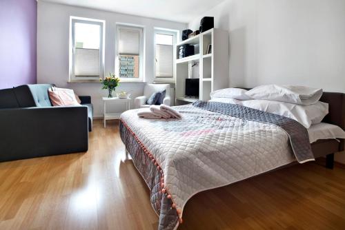 Posteľ alebo postele v izbe v ubytovaní P&O Apartments Bielany