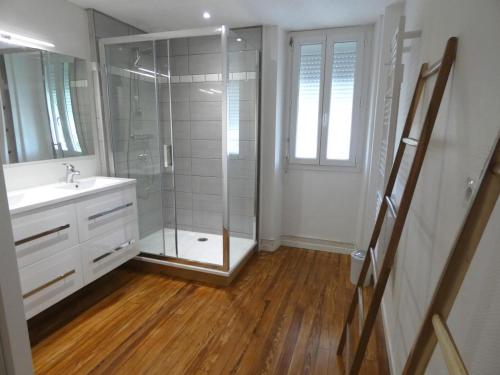 a bathroom with a shower and a sink and a mirror at Condrine in Saint-Cricq-Chalosse