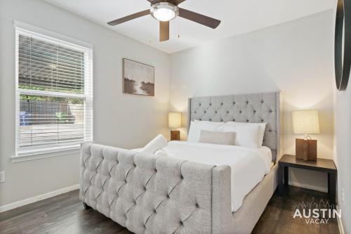 a bedroom with a bed and a ceiling fan at Walk to Barton Springs Spacious Apt Backyard in Austin