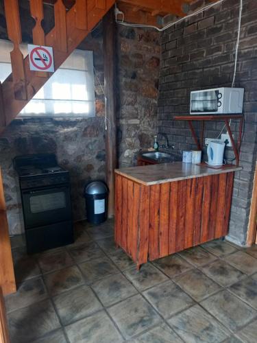 a kitchen with a sink and a stove at Slypsteen Accomodation in Sternham