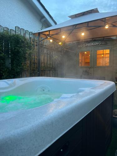 a large bath tub with steam coming out of it at Sixty Four in The Mumbles