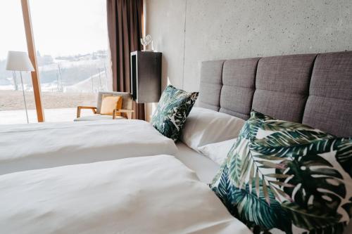 Tempat tidur dalam kamar di RELAX APARTMENTS Hochgraßnitzberg