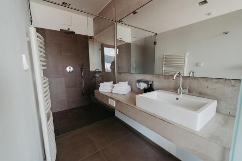 a bathroom with a sink and a mirror at RELAX APARTMENTS An der Lage Hochgraßnitzberg in Spielfeld
