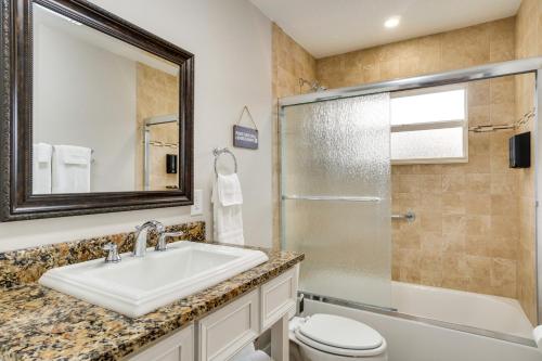 a bathroom with a sink and a toilet and a shower at Family-Friendly Home in Casselberry with Fire Pit! in Orlando