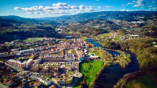 an aerial view of a town next to a river at Hotel O Guerreiro in Ponte da Barca