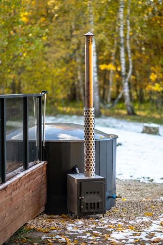 a large appliance with a smoke stack on the ground at Kuusemäe Puhkemaja in Rägavere
