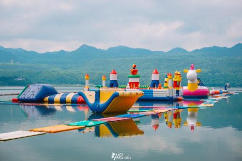 a row of inflatable water toys in the water at เดอะวอเตอร์ปาร์ครีสอร์ท- The Water Park Resort in Ban Laem Mong Khoi