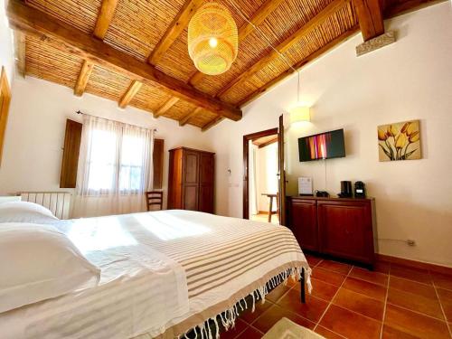 Postel nebo postele na pokoji v ubytování Agriturismo Li Scopi