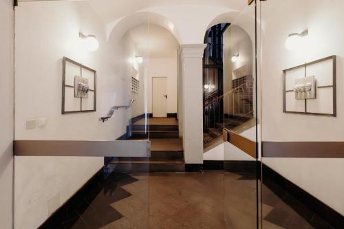 a hallway with a glass door in a building at Al Castello di San Giusto free garage in Trieste