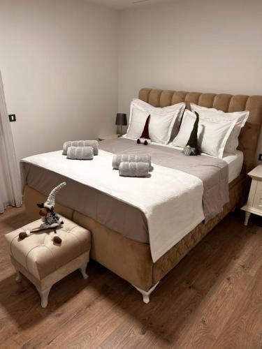 a large bed with white sheets and pillows in a bedroom at Ivana&Luka-Put luke 1, Brela in Brela