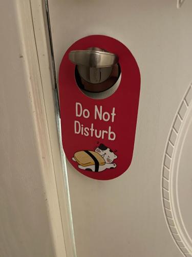 a sign on a door that says do not disturb at Zimmer Boutique Hotel in Baku