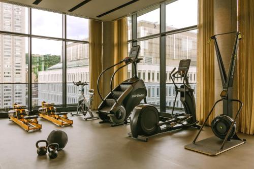 a gym with treadmills and exercise equipment in a building at Sonder Maisonneuve in Montréal