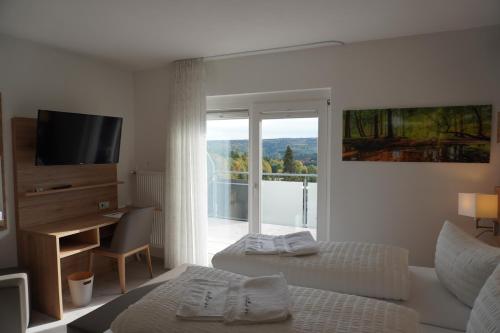 Ліжко або ліжка в номері Hotel Talblick