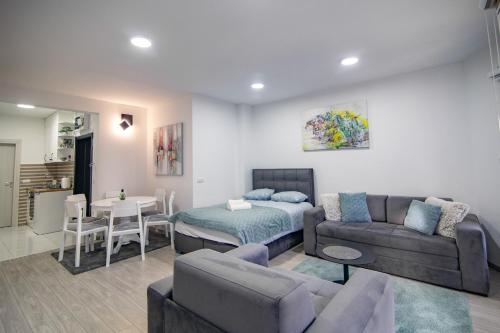 a living room with a couch and a table at Apartman Tibor in Zlatibor