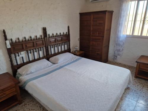Cama o camas de una habitación en Villa Rural Málaga Aeropuerto