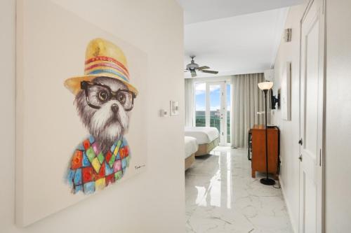 a painting of a monkey wearing a hat and glasses at Biarritz Studio - Beautiful Ocean View Studio in San Juan