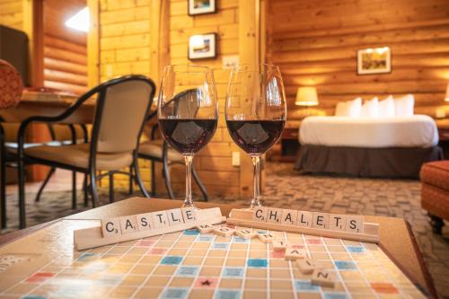 two glasses of wine sitting on a table at Castle Mountain Chalets in Castle Junction