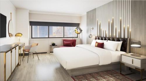 a bedroom with a large white bed and a desk at Executive Class at MTS Hotel in New York