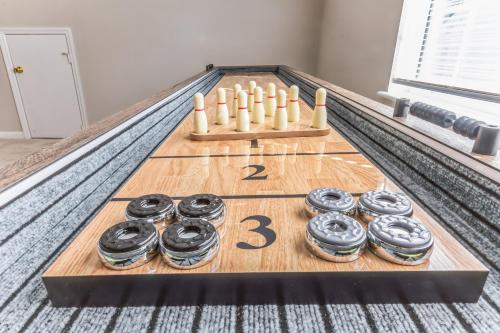 a game of bowling with chocolate donuts and aedes at Lowcountry haven - game rm + king bds, mins 2 dwtn in Charleston